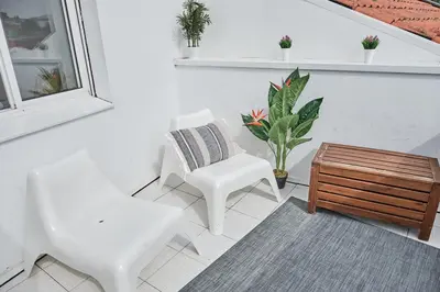 a living room with two chairs and a coffee table at 9Estudio Sightviews in Santiago de Compostela