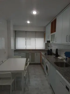 a living room with a couch and a table at A Pia da Moura in Ourense