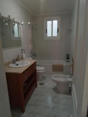 a bedroom with a large bed with two white pillows at A Pia da Moura in Ourense