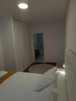 a small bedroom with a bed and a window at A Pia da Moura in Ourense