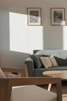 a living room with a couch and a table at Avós Apartamentos in Monforte de Lemos