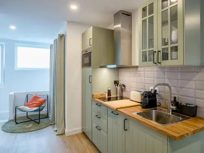 a kitchen with a sink and a counter top at Alojamientos 