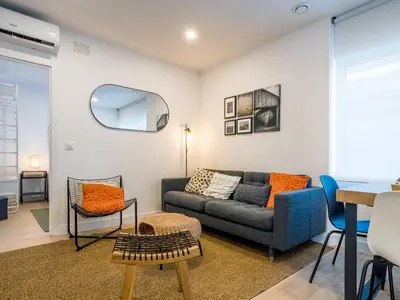 a living room with a couch and a table at Alojamientos 