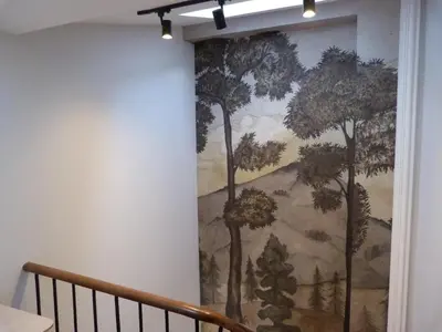 a mural of trees on the wall of a room at Foroplaza Duplex in Lugo
