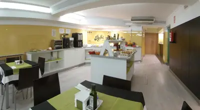 a kitchen and dining room with a table and chairs at Nest Style Santiago in Santiago de Compostela