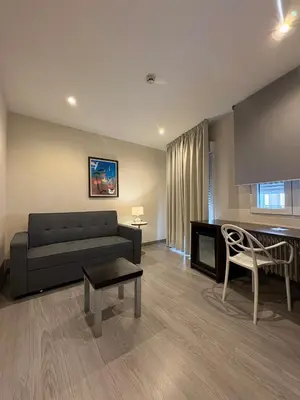 a living room with a couch and a table at Nest Style Santiago in Santiago de Compostela