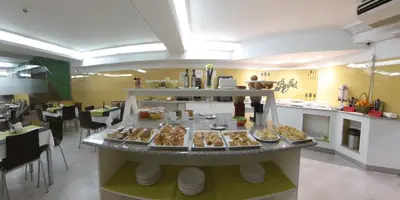 a kitchen with a buffet of food on a table at Nest Style Santiago in Santiago de Compostela