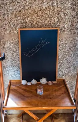 a wooden table with a picture on top of it at Alda Fogar Natural in Santiago de Compostela