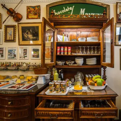 a kitchen with a counter with food on it at Hotel Monumento Pazo de Orbán in Lugo