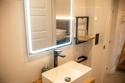 a bathroom with a sink and a mirror at pension campillo in Fonsagrada