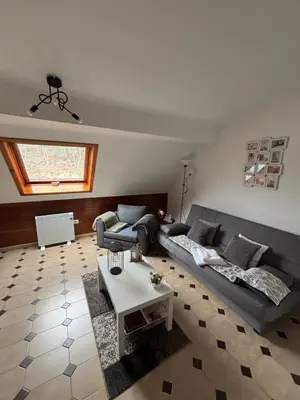 a living room with a couch and a table at Apartamento 16 in Ribadavia