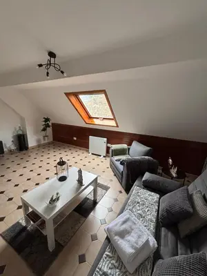 a living room with a couch and a table at Apartamento 16 in Ribadavia