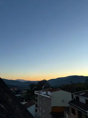 a view of the sunset from the roof of a building at Apartamento 16 in Ribadavia