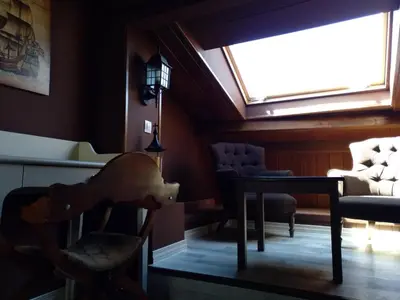 a room with a table and chairs and a window at Hostal Medievo in Monforte de Lemos