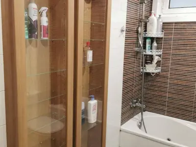 a bathroom with a shower and a tub and a sink at Apartamento con 2 habitaciones y vistas a la Ría del Burgo in Cambre