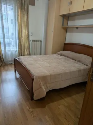 a bedroom with a large bed in a room at Apartamento con 2 habitaciones y vistas a la Ría del Burgo in Cambre