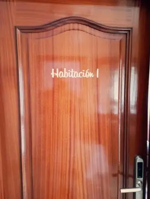 a wooden door with the word hiltonovation on it at Vilariño in Ordes