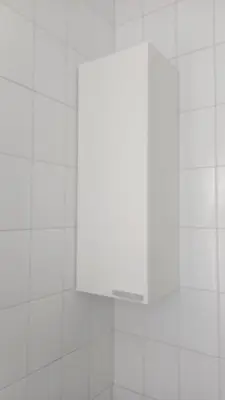 a white tiled wall in a bathroom with a mirror at Vila Montecelos in Antas de Ulla