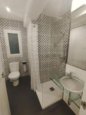 a bathroom with a toilet and a sink at Mamá Ignacia in Lugo
