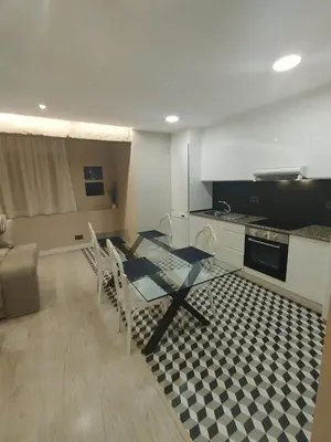 a kitchen with a table and chairs in a room at Mamá Ignacia in Lugo