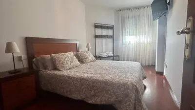 a bedroom with a bed and a window at La Atalaya de Sanci in San Ciprián