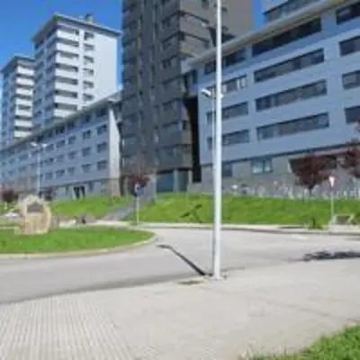 a street corner with a traffic light and a building at Apartamentos Turísticos Cancelas by Bossh Hotels in Santiago de Compostela
