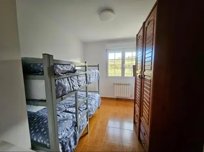 a kitchen with a table and chairs in it at Casa Pepe in Ourense