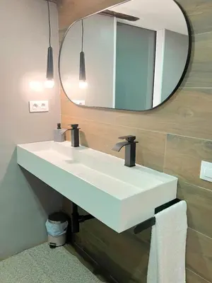 a bathroom with a white sink and a mirror at O Luar in Piñeira Seca