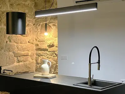a kitchen with a sink and a vase on a counter at O Luar in Piñeira Seca