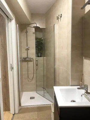 a bathroom with a shower and a sink at Pension A Casiña D,avoa Oseira in Osera