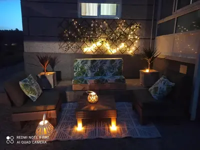 a living room with a couch and a table and lights at Eido do Avelán in Mondariz