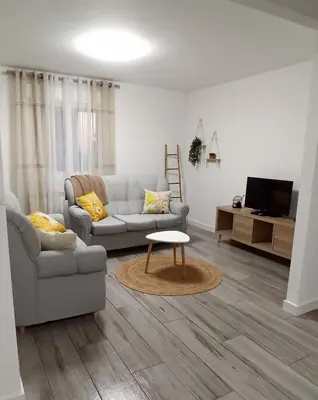 a living room with a couch and a table at Eido do Avelán in Mondariz