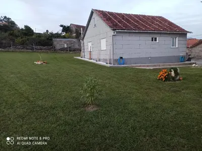a large yard with a building and a house at Eido do Avelán in Mondariz