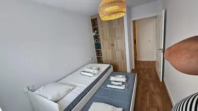 a living room with a white couch and a chandelier at Costa verde asturiana - VUT4692AS in El Espín