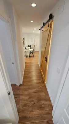 a hallway with a wooden door in a house at Costa verde asturiana - VUT4692AS in El Espín