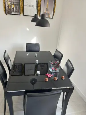 a black dining table with four chairs at Dream House II -Termas cerca -parking gratis- in Ourense