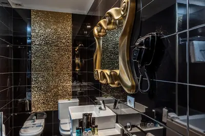 a bathroom with two sinks and a mirror at Motel Venus La Coruña in Guísamo