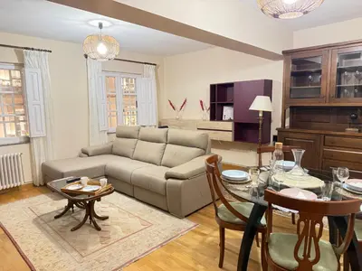 a living room with a couch and a table at Santa María in Lugo