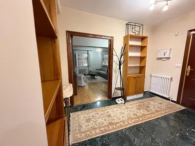 a hallway with a door open to a living room at Santa María in Lugo
