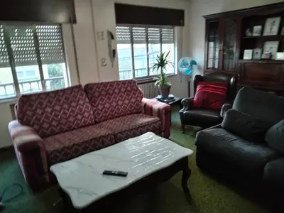 a living room with a couch and a coffee table at Casa albergue Pty in Sarria