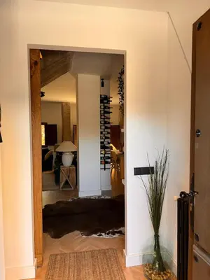 a hallway leading into a living room with a doorway at Casa boutique-rural en El Bierzo in Torre del Bierzo