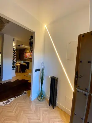 a hallway with a vase with a plant in it at Casa boutique-rural en El Bierzo in Torre del Bierzo