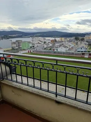 a balcony with a view of a city at Foz te espera in Foz