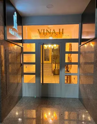 a front door of a vaan store with a window at Aparthotel A&M VIÑA II in Jove