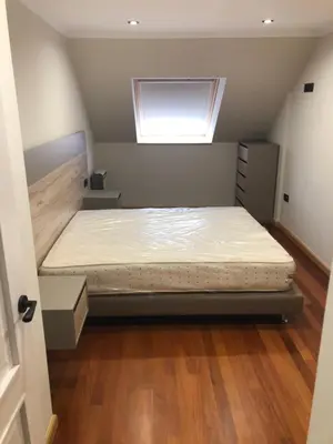 a bedroom with a bed in a room with a window at Aparthotel A&M VIÑA II in Jove