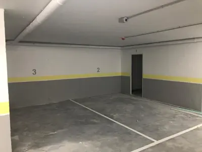 an empty garage with a room with a door at Aparthotel A&M VIÑA II in Jove