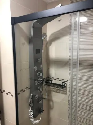a glass shower door with a phone in a bathroom at Aparthotel A&M VIÑA II in Jove