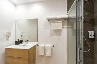 a bathroom with a sink and a shower at Urbanfive apartamentos Ourense centro in Ourense
