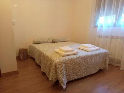 a bedroom with a bed with towels on it at Estrella del alba in Villarino de Sanabria
