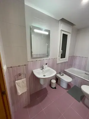a bathroom with a sink and a toilet and a tub at Trailhouse CASTELAO in Sarria